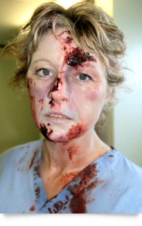 Woman with casualty make-up